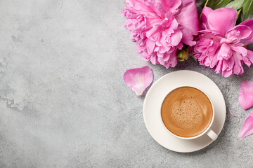 Hot coffee and pink peony flowers