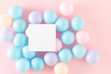 balls kids on a pink backround with white paper. Minimal concept. Flat lay.