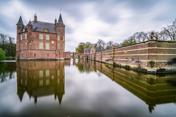 Fototapeta na wymiar An ancient Dutch castle reflected in the pond
