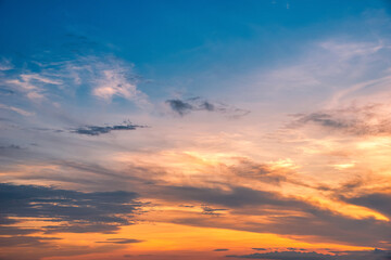 Beautiful cloudscape and dramatic sunset over mountain and sea.