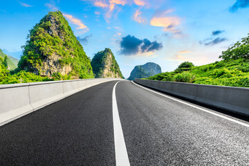 Empty asphalt road and green mountain nature landscape.Highway and mountain background.