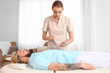 Reiki master working with patient