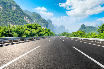 Empty asphalt road and green mountain nature landscape.Highway and mountain background.