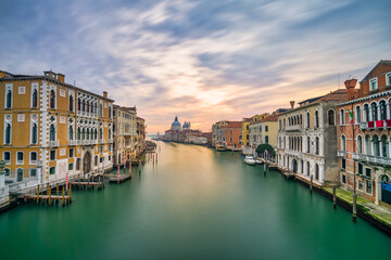 Fototapeta na wymiar Grand Canal and Basilica Santa Maria della Salute at sunrise in Venice, Italy