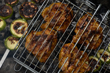 Grilled chicken with golden crust and zucchini.