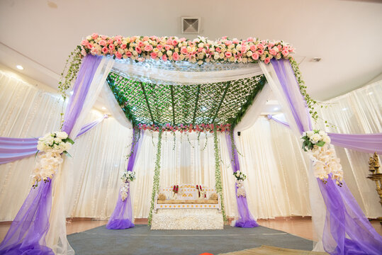 Mandap for a wedding ceremony in a decorated hall