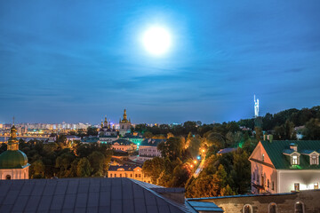 Fototapeta premium Pechersk Lavra or Monastery of the Caves and skyline of Kiev at night. Ukraine
