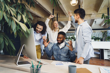 Happy overjoyed business team celebrate corporate victory