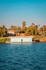 Vertical view of a floating boat house on the Nile River near Edfu, Egypt