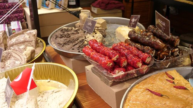 Layout showcase of goodies at the fair - variety of Turkish sweets: halva, marshmallow, Turkish delight, churchkhela