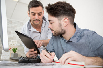 successful two architects in casual wear communicating