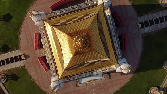 Bird's eye view cinematic Buddhist temple roof dome decor Golden abode of Budda Shakyamuni Kalmykia Russia Elista incredible traditional shrine circle. Travel best landmark cityscape. Sunny stock film