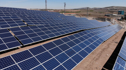 Aerial view of close up solar power panels, in desert.