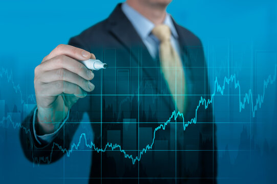 Financial growth concept. Businessman pointing graph corporate future growth plan on dark blue. Economic Recovery Process after the Coronavirus Pandemic.