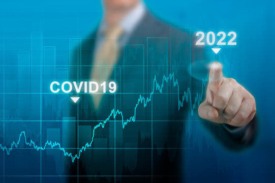 Economic Recovery In 2022. Timeline Chart Diagram Of Global Economic Recovery After The Crisis Caused By The Covid19 Pandemic. Businessman Pointing Graph Corporate Future Growth Plan On Dark Blue