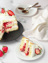 Strawberries and heavy cream layered cake. White background