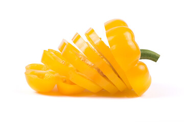Fototapeta na wymiar Fresh juicy yellow paprika sliced with slices on a white background