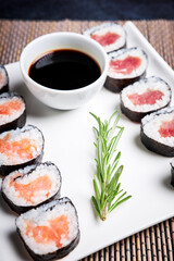 Close-up of plate with sushi and bowl of soy sauce. Asian food. Healthy food concept