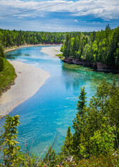 View on the incredibly blue waters of the Bonaventure river in Gaspesie (Quebec, Canada)