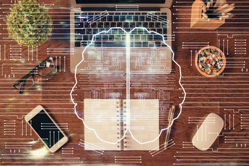 Double exposure of brain drawing hologram over topview work table background with computer. Concept of big data.