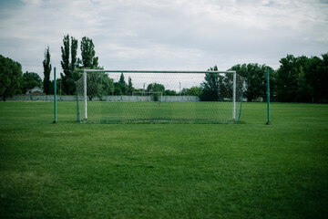 football gate on the green grass field. Goal post
