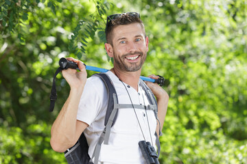 happy hiker man in the top of the mountains