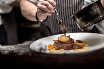 Closeup shot of a cook preparing a delicious dish