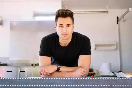 Food truck concept. Waiter looking at camera.