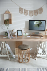 Stylish home office interior with comfortable workplace