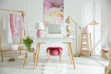 Stylish home office interior with comfortable workplace