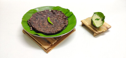 Protein rich Ragi roti made from Finger millet placed in a banana leaf plate and served with chutney . South indian dish. Breakfast. Traditional.