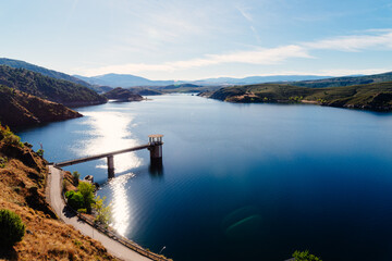 The Atazar reservoir and dam in the mountain range of Madrid, Spain