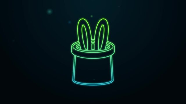 Glowing neon line Magician hat and rabbit ears icon isolated on black background. Magic trick. Mystery entertainment concept. 4K Video motion graphic animation
