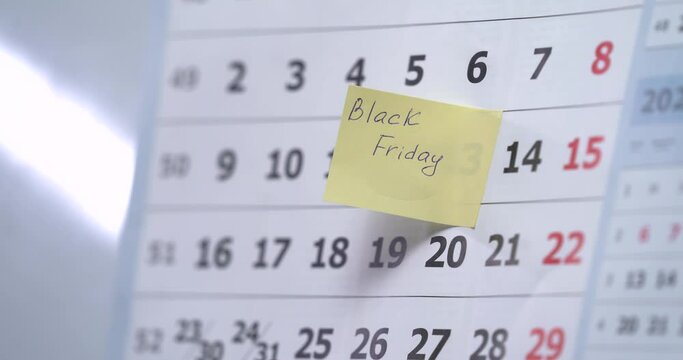 Close-up shot of calendar. Man's hand wright BLACK FRIDAY member for himself