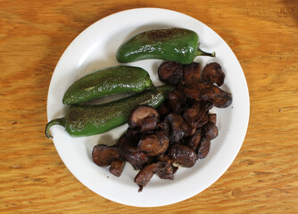 Roasted Green Jalapeno Peppers With Mushrooms in Rural Cafe