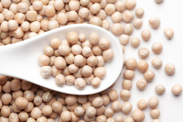 Macro Close up of Close up of Organic dry peas whole (Pisum sativum) or matar dal on a white...