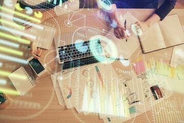 Double exposure of woman hands working on computer and data theme hologram drawing. Top View. Technology concept.