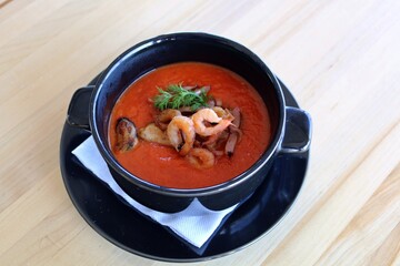 Tomato puree soup with seafood