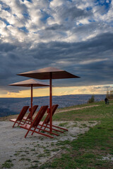 Sun loungers and parasols at the Hambach opencast mine vantage point , Germany.