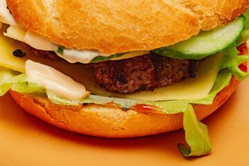 Closeup of home made burger. Burger on a beige plate. food.