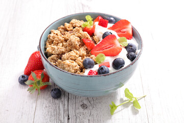 bowl of muesli, berries fruit and yogurt