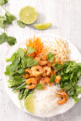 asian dish with spicy shrimp, noodles and coriander