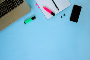 The view from the top. Workspace. Marker, glasses, diary or Notepad, pen Copy space