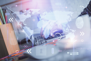 Double exposure of woman hands working on computer and world map hologram drawing. International technology business concept.