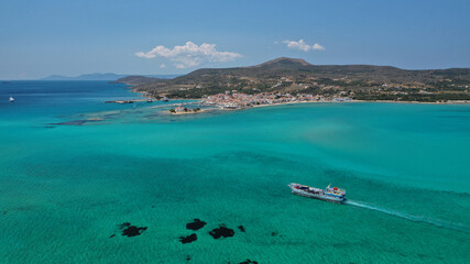 Aerial drone photo of picturesque seaside main village of Elafonisos island, Lakonia, Peloponnese,...