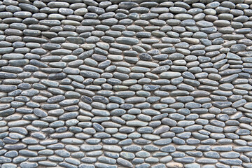 Stone wall with repetitive pattern ideal for background or textural use