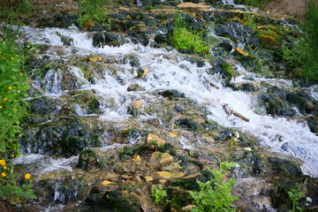Slovenian Keys waterfall, illuminated source, living water out of the ground in the Izborsk, near...