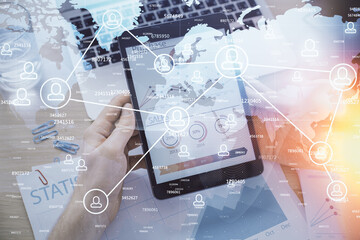 Double exposure of man's hands holding and using a phone and social network theme drawing.