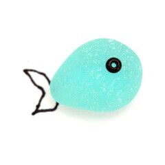 funny little fish made of a piece of seaglass, with sketchily drawn fins, isolated on white background
