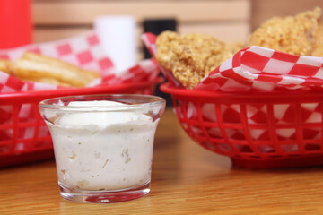 Fried Catfish With Tartar Sauce and French Fries in Cafe